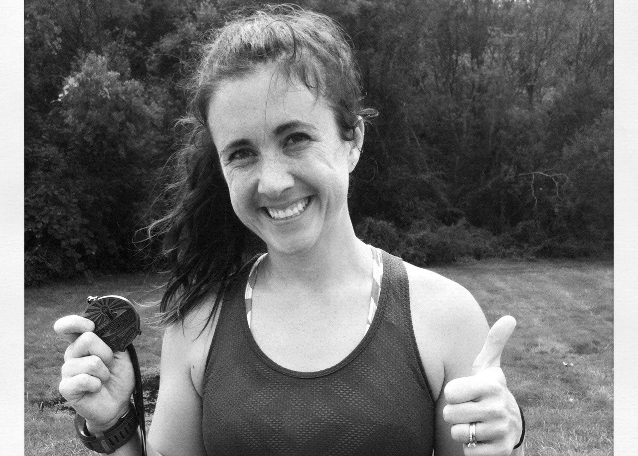 Katie is all smiles at the finish line!