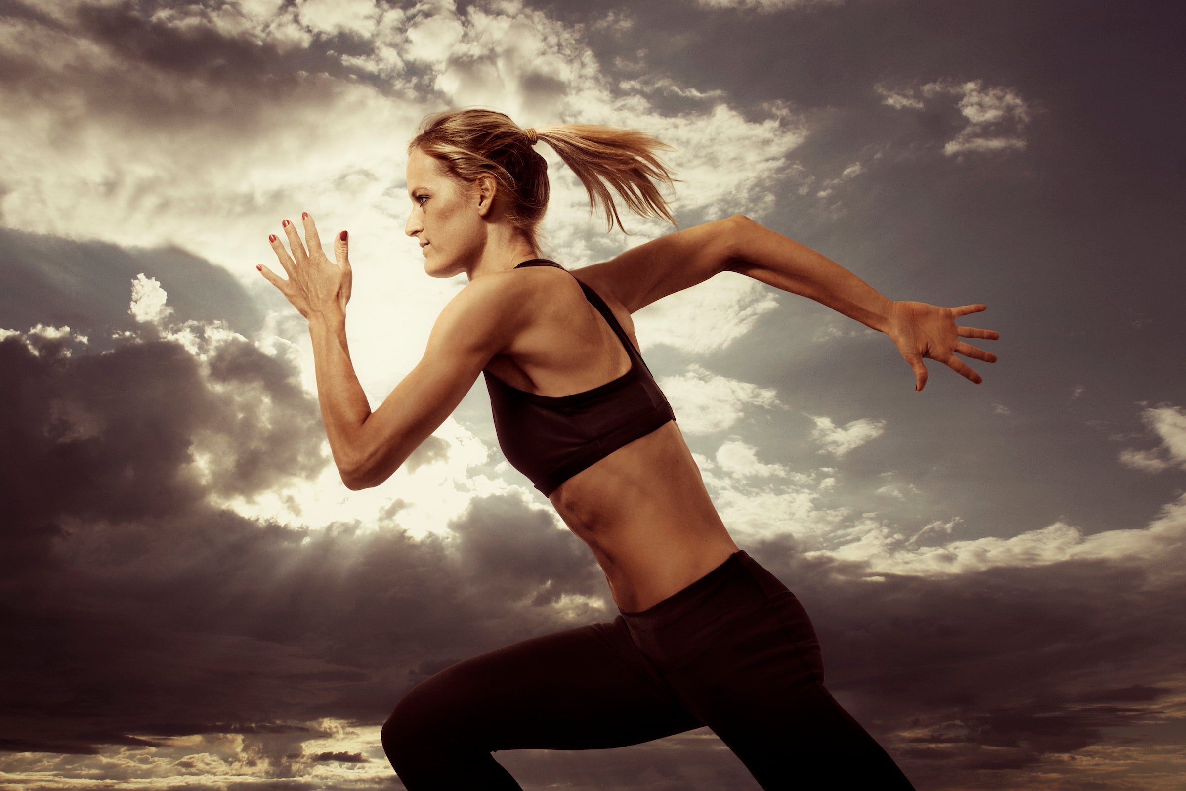 woman running hard to boost vo2 max