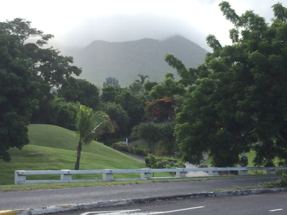 Mount Nevis, a dormant volcano, is shrouded in clouds in the early morning