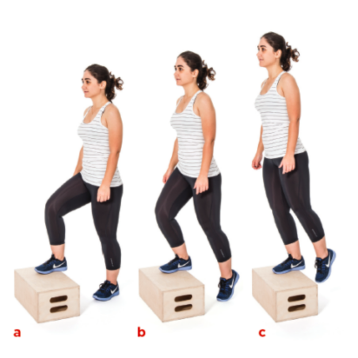 woman doing step ups onto a box to activate glutes