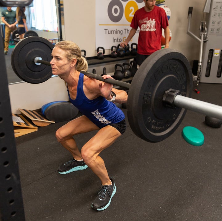 PHOTO: James Q. Martin Kellyn Taylor, also a trained fire fighter, impresses even her teammates with her strength in the gym.