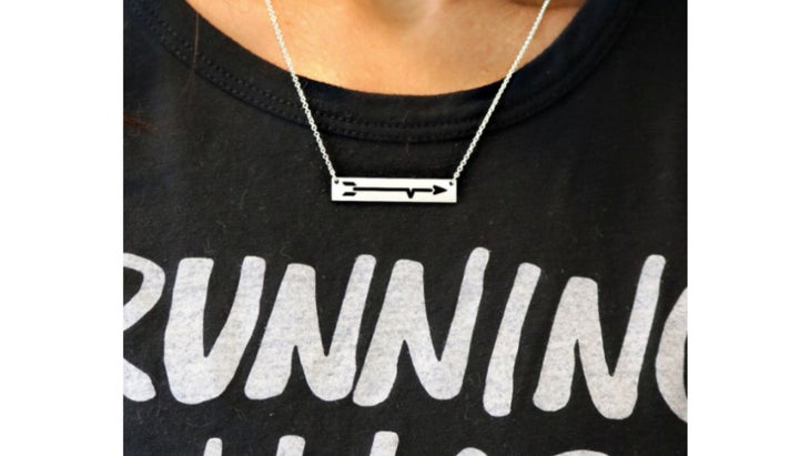 Bar necklace with arrow cutout on model
