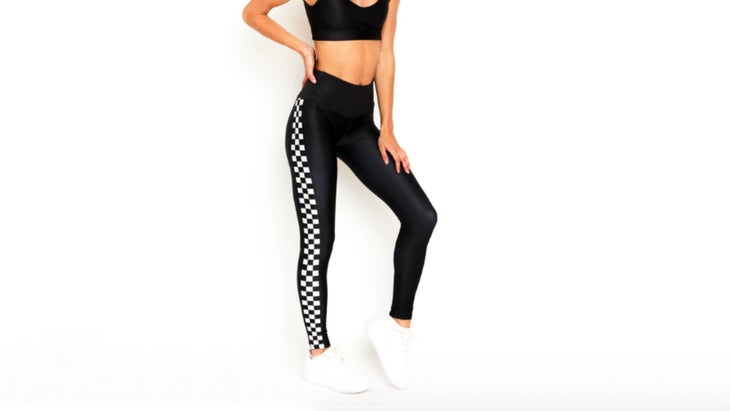 Black leggings with checkered side stripe on model