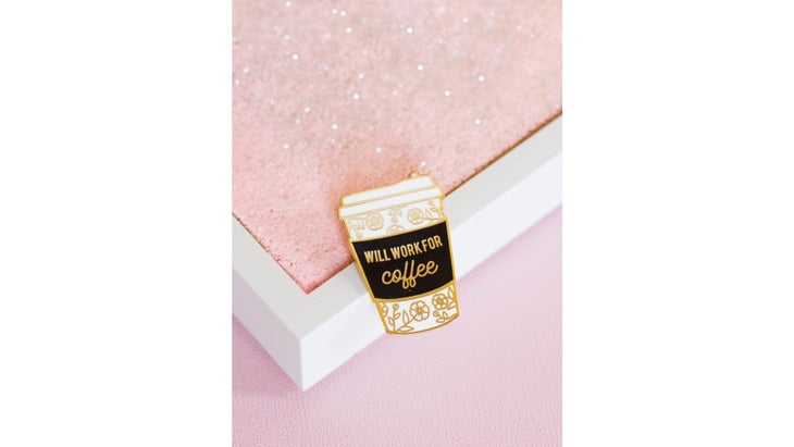 Coffee cup-shaped pin saying "will work for coffee"