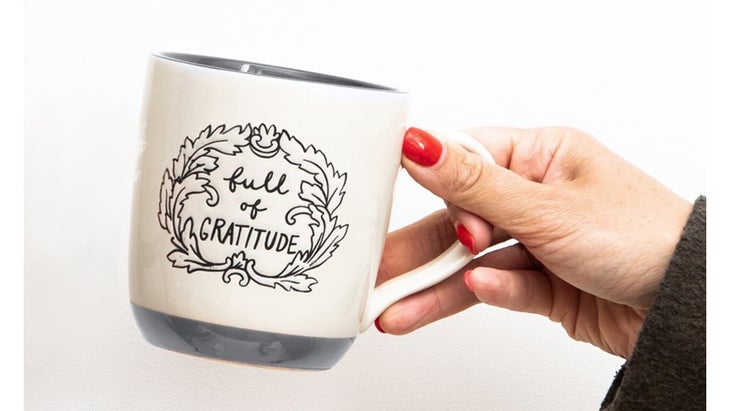 White mug with the words "full of gratitude"