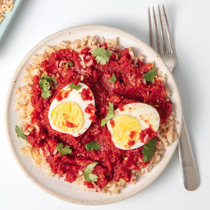 Plate of masala over rice with fork