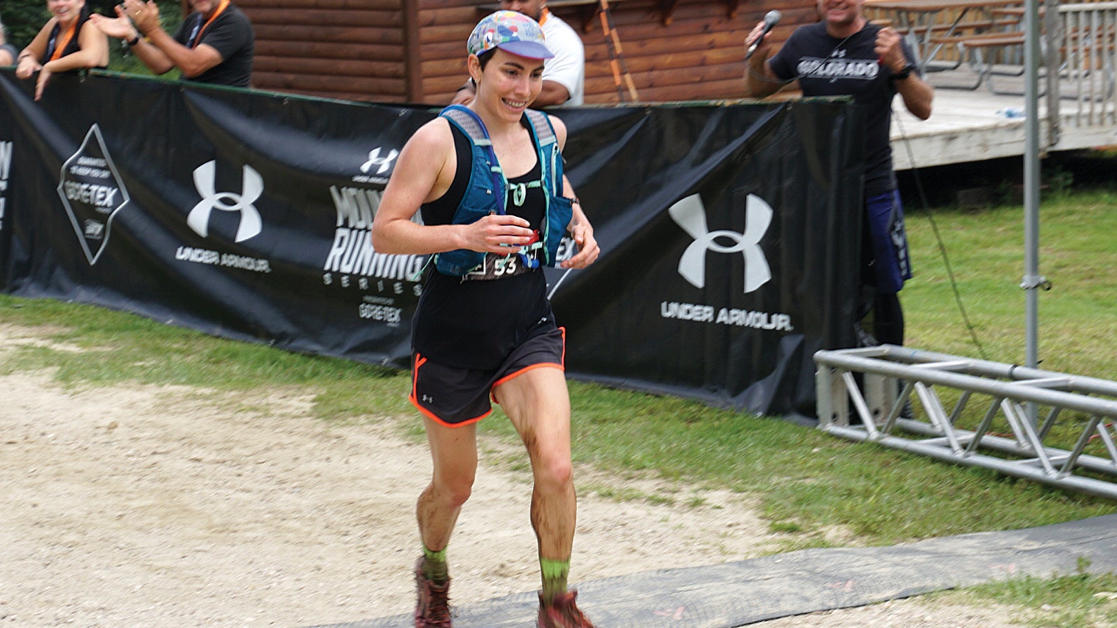 Author Molly Hurford crossing the finish line of a 50K race