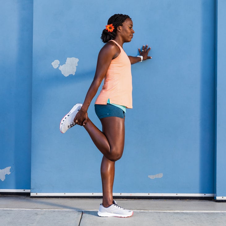Alysia Montano in a standing quad stretch