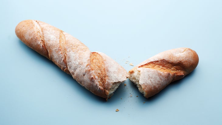 Baguette torn into two pieces