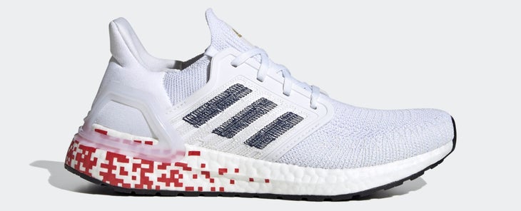 All-white running shoe with red pixels on back of sole and blue adidas logo