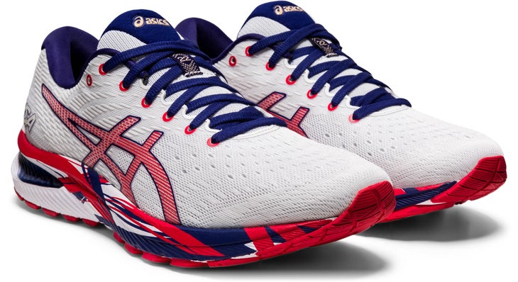 White running shoes with blue laces, red logo, and red and blue soles