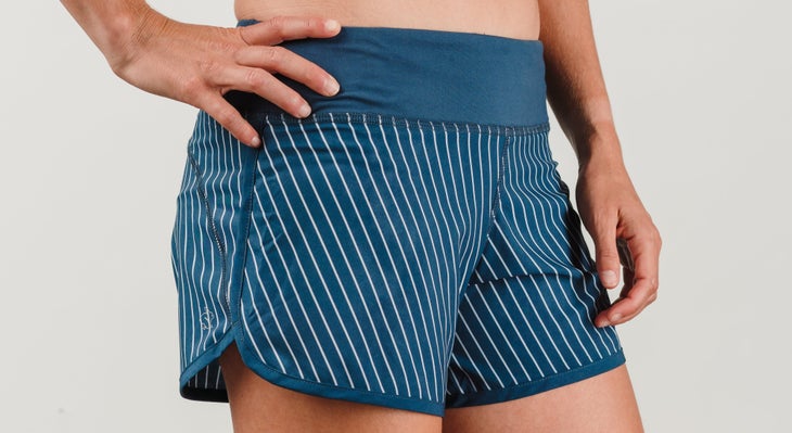 Blue running shorts with white pinstriping