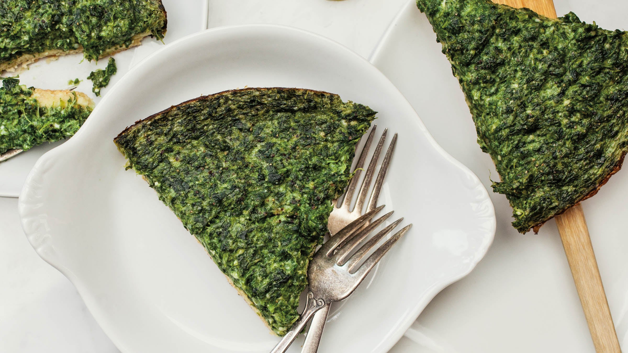 Slices of spinach & feta pie on a table