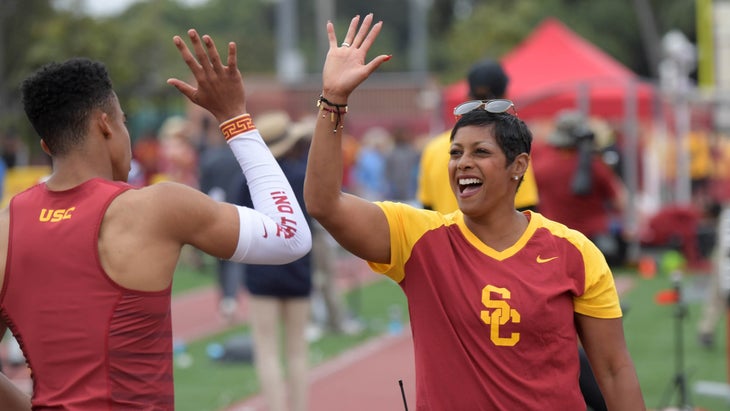 Caryl Smith Gilbert high fives one of her runners