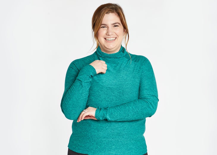 woman wearing green long sleeve athleisure top