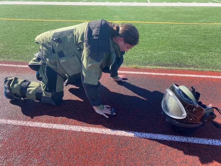Katie Hernandez after breaking the world record for running a mile in a bomb disposal suit