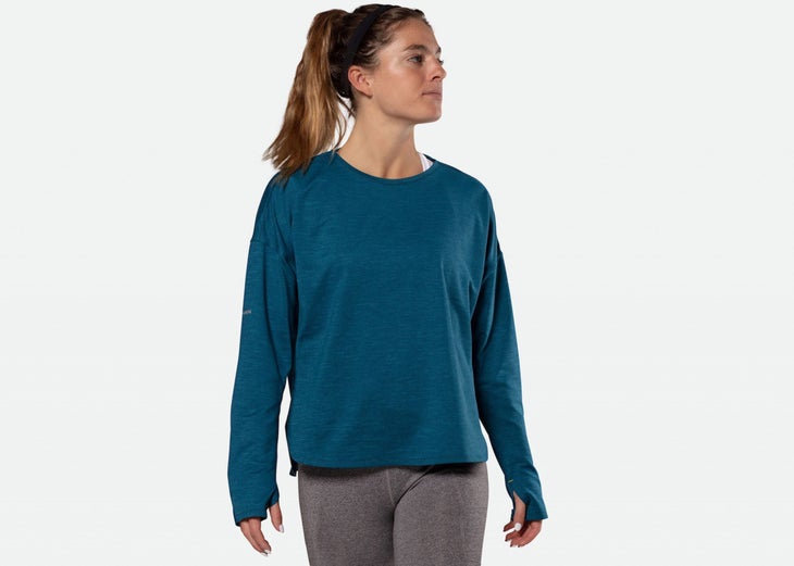 woman wearing blue long sleeve athleisure top