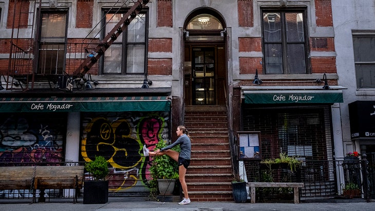 Mary Cain stretches on a city block in NYC