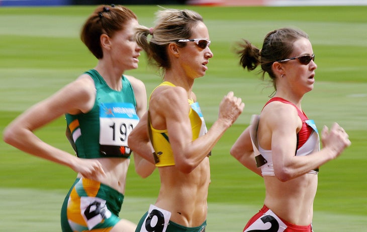 Malindi Elmore leading two other woman on a track
