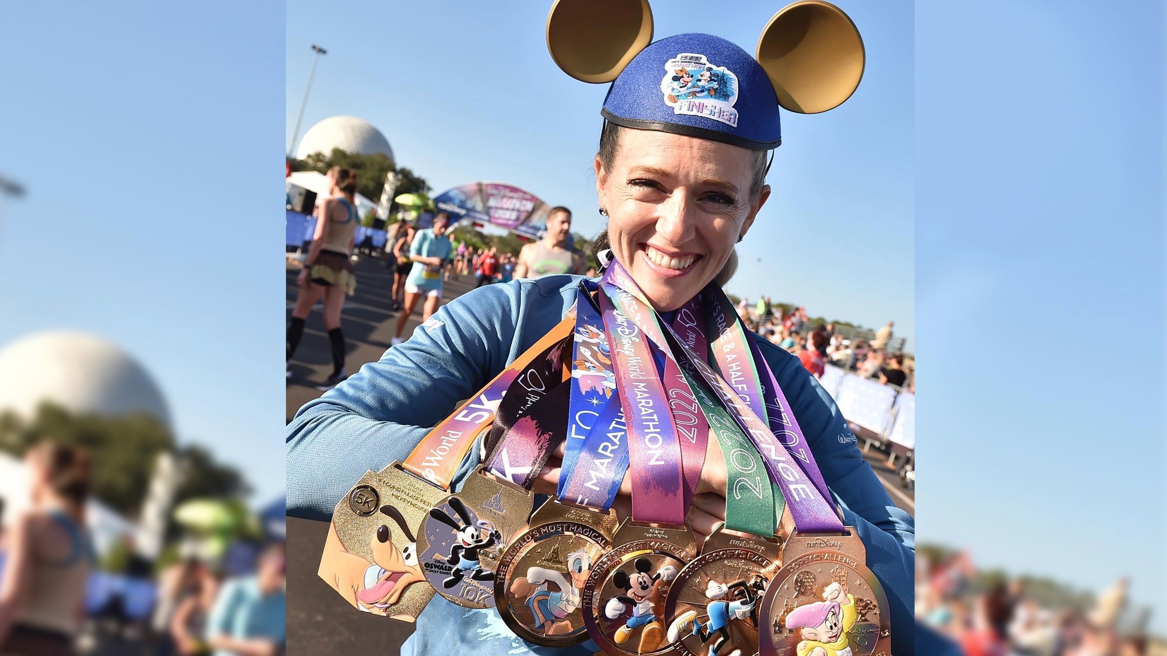 Brittany Charboneau poses with several medals after running runDisney's Dopey challenge