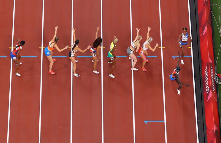 an overhead view of Athing Mu being passed the baton during the 2020 Olympics