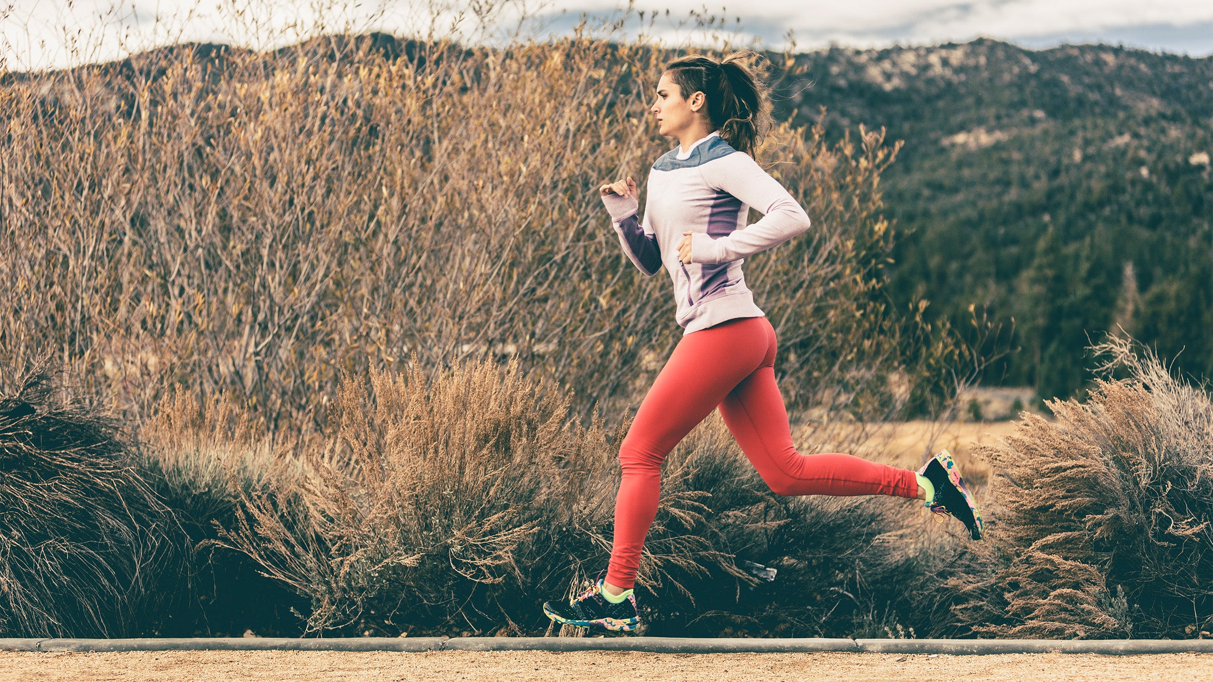 Woman running outside on a fall day