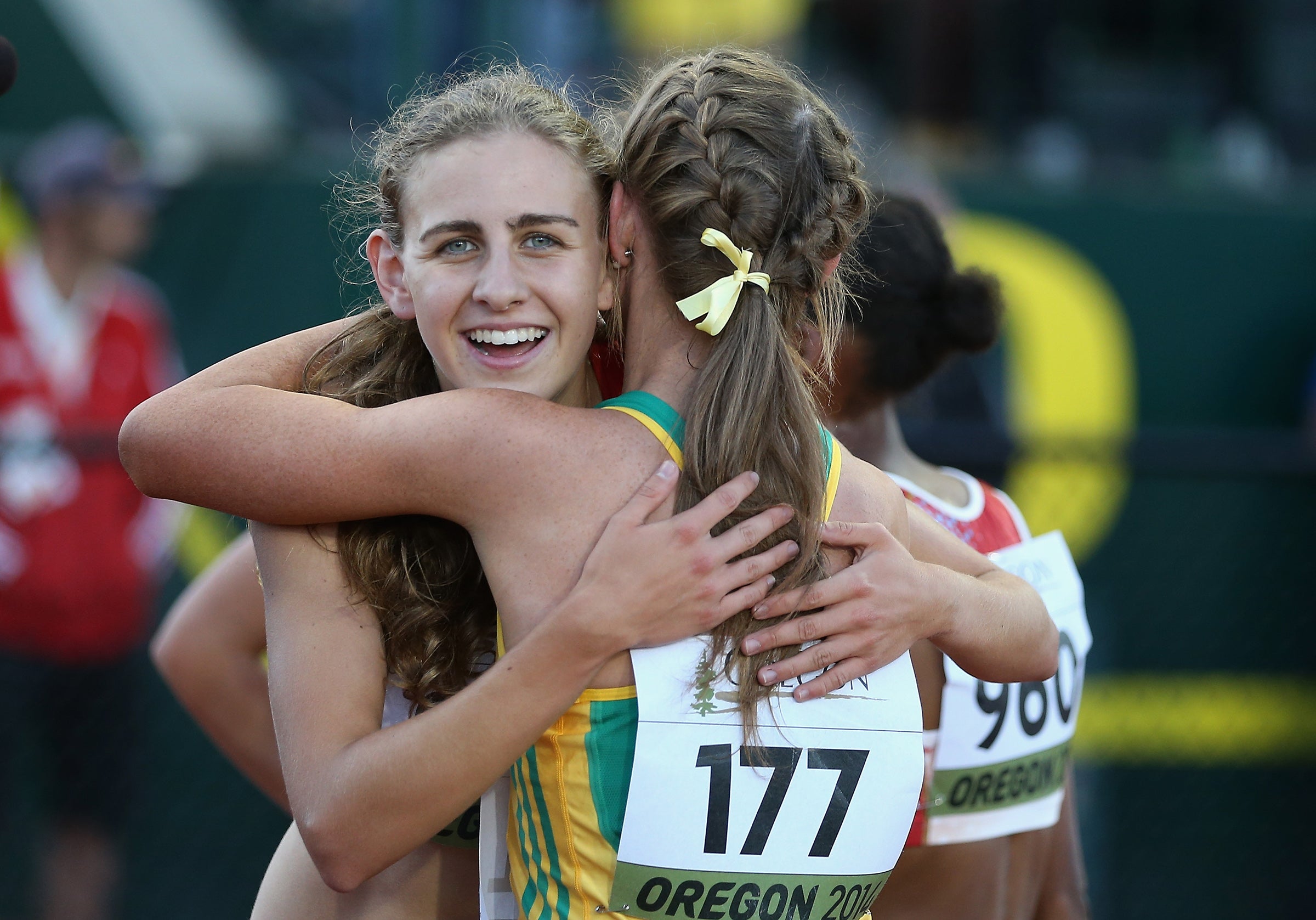 Mary Cain hugging another female runner in 2014