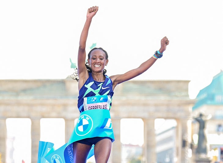 Gotytom Gebreslase celebrates breaking the tape at the Berlin Marathon