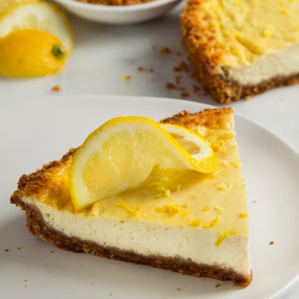 slice of tofu cheesecake with lemon slice on top