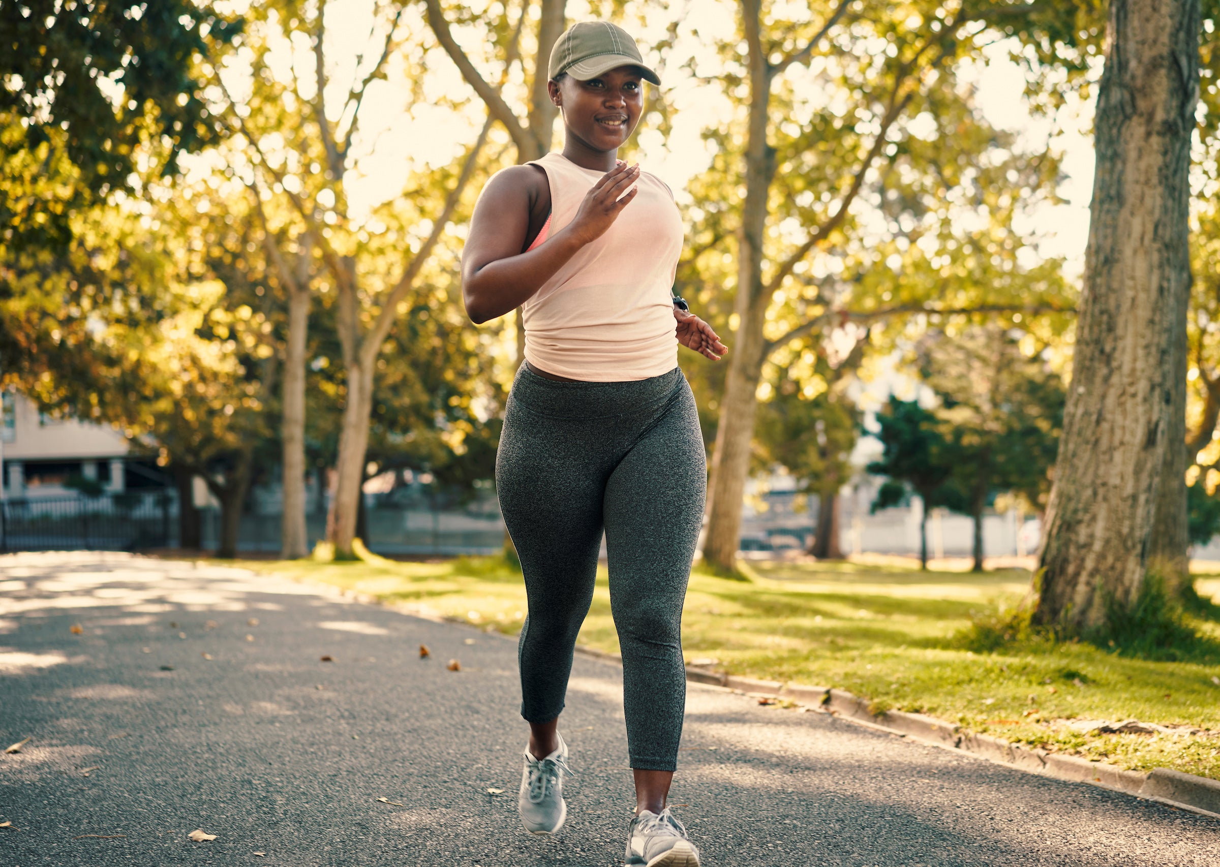 Shot of a young woman going for a run in the park