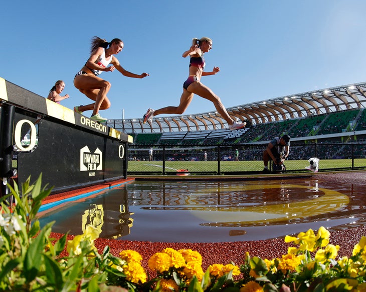 Courtney Wayment and Emma Coburn jump over a water pit during the USATF champs semifinal.