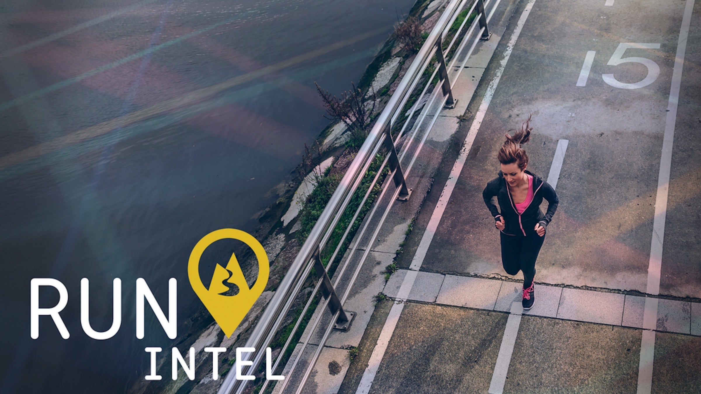 A woman running across a bridge as seen from above