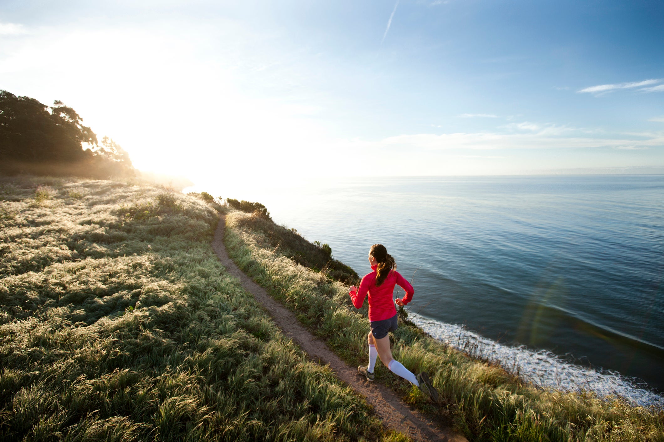 A female trail running near Santa Barbara.