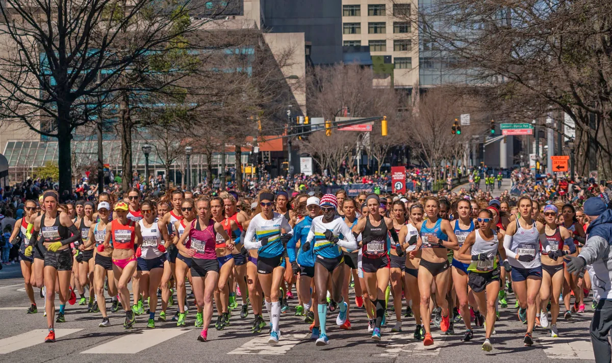 Aliphine Tuliamuk (center, wearing a knit hat) was front and center at the start of the women's 2020 U.S. Olympic Trials Marathon in Atlanta  