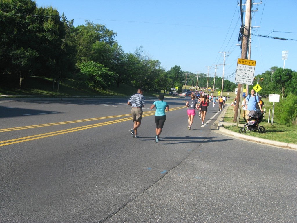Courtney's dad running with her at a race two summers ago.