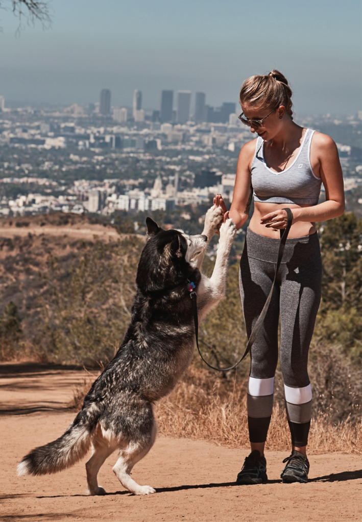 Cover Runner Nikita gives Renee Wymer a high-five for a run well done.