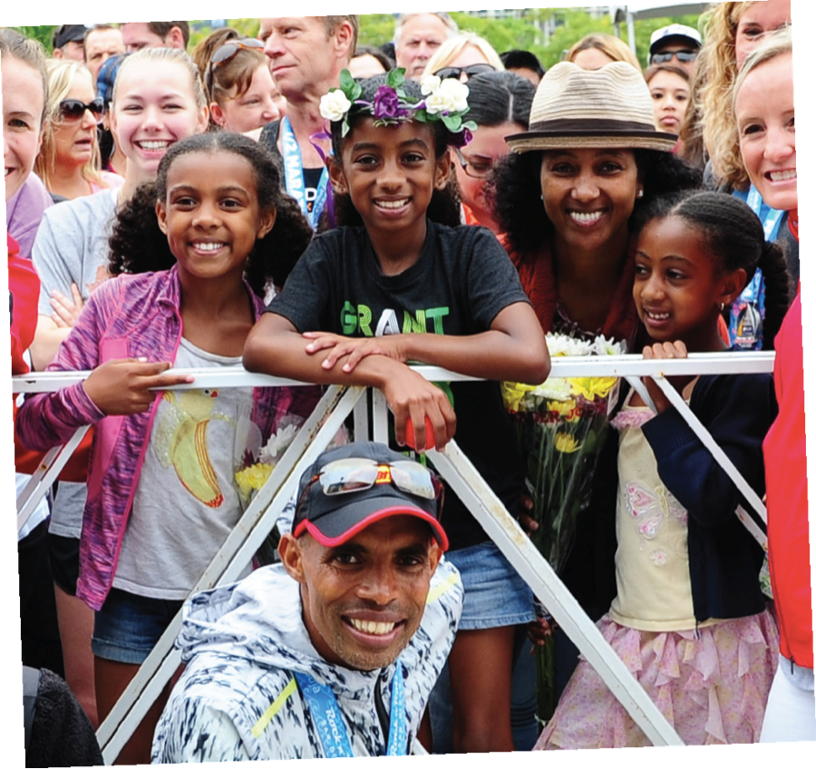 Meb Keflezighi takes poses with Yordanos and their kids at the Rock ‘n’ Roll San Diego finish.