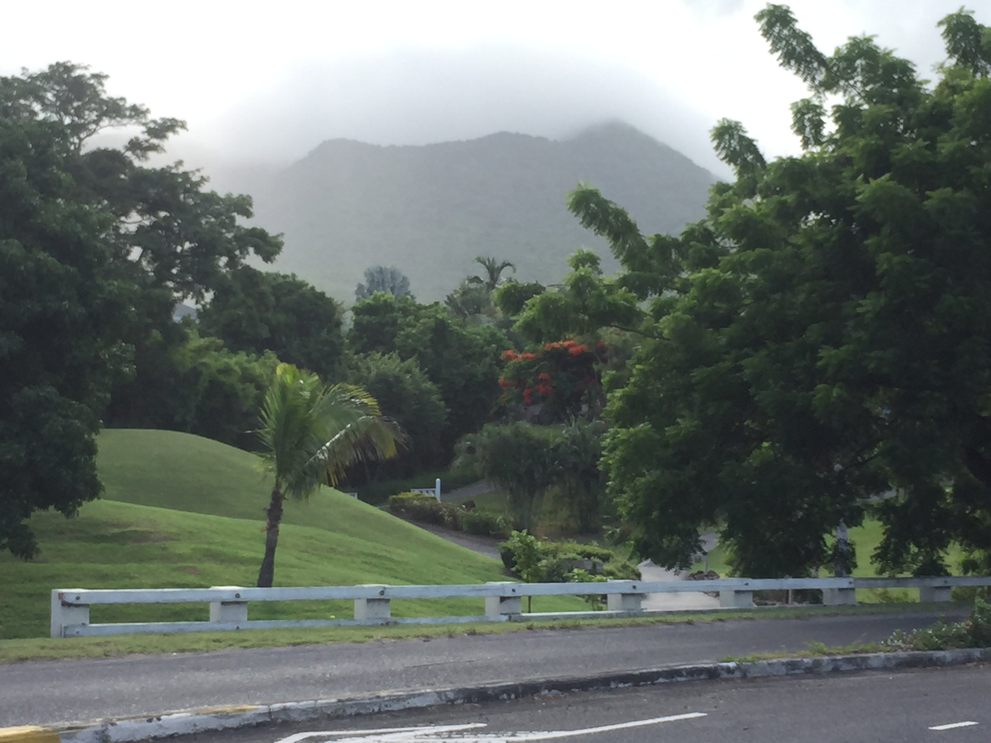 Mount Nevis, a dormant volcano, is shrouded in clouds in the early morning