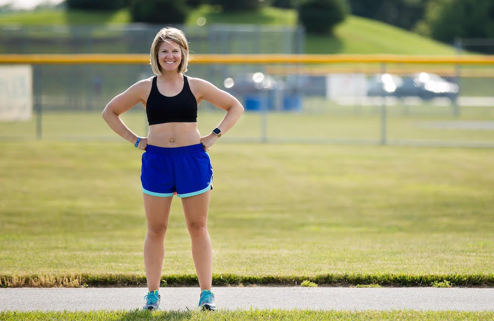 girl running in sports bra