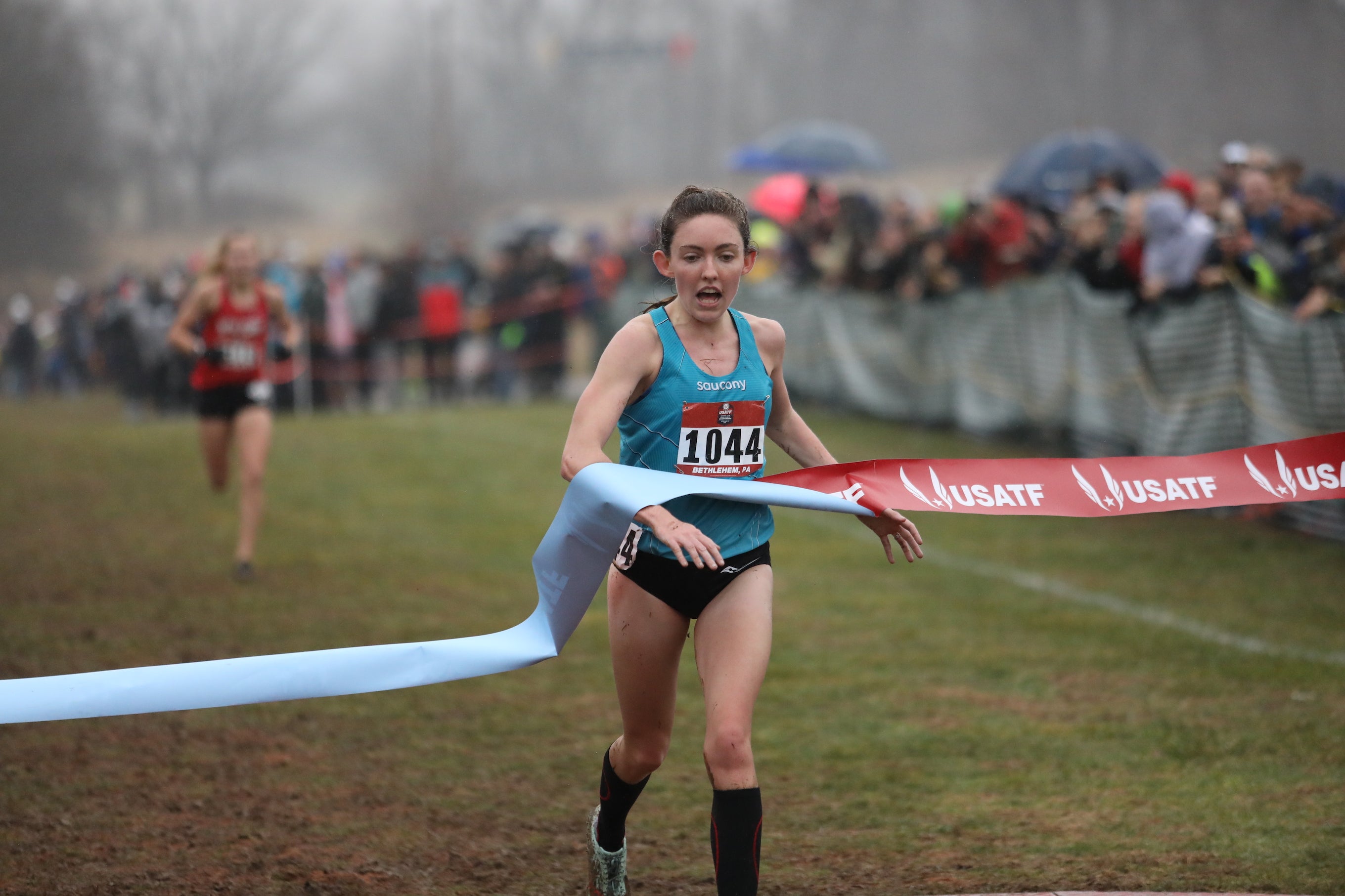 The 2019 USATF Club Cross Country open women's champion Aisling Cuffe, 26, breaks the tape at Lehigh University, representing Saucony.