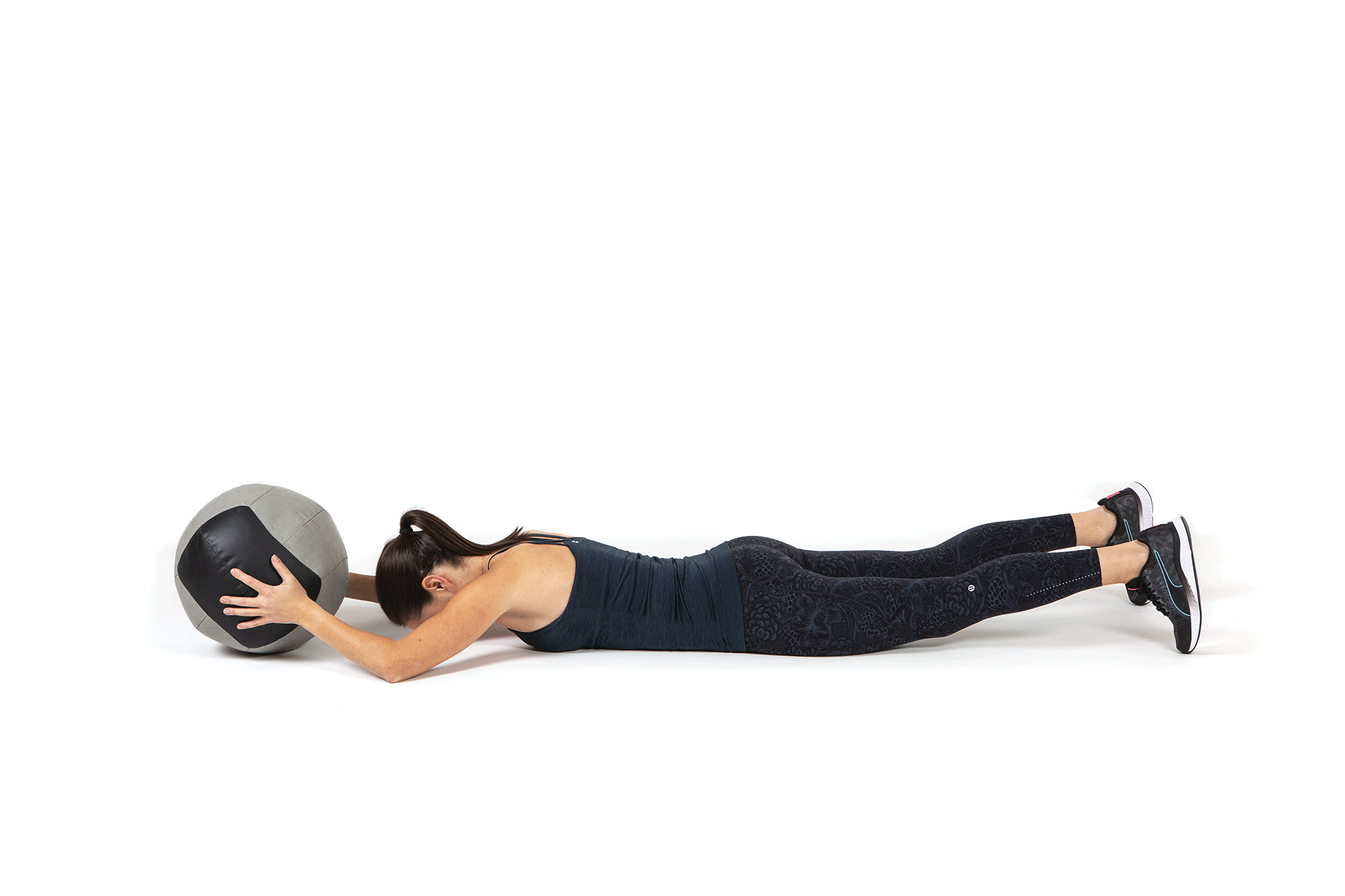 Animation of woman lying prone on floor and tossing medicine ball out