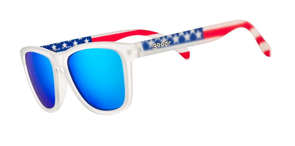 Sunglasses with blue lenses, white frames, and American flag-pattern arms