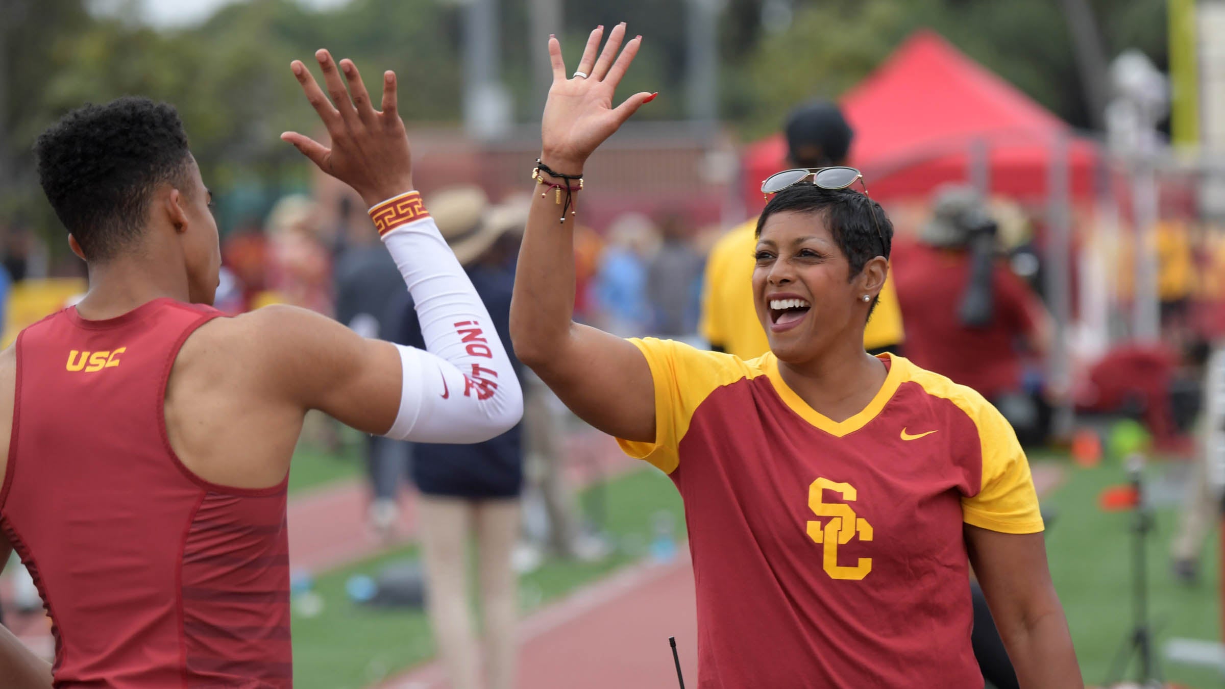 Caryl Smith Gilbert high fives one of her runners