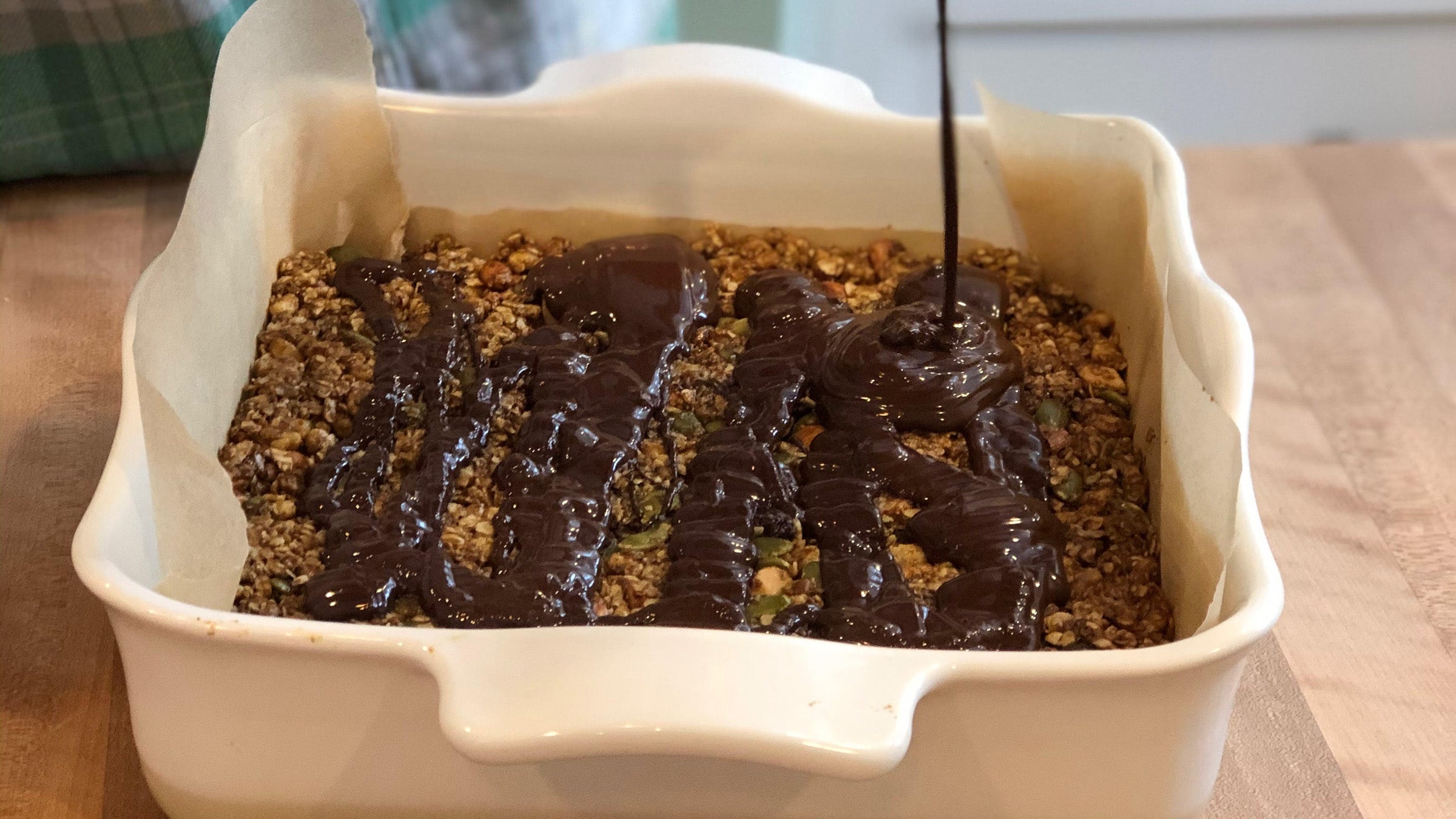 Melting chocolate over Elyse Kopecky's no-bake granola bars, a snack high in iron